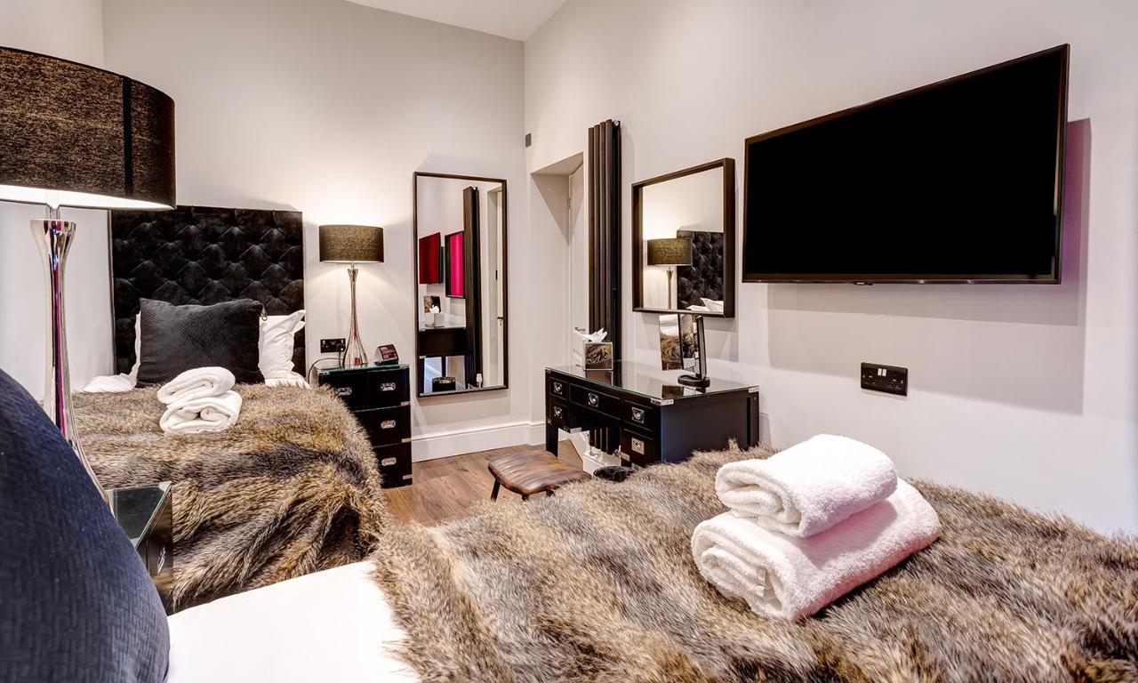 Kotel Віндермір Екстер'єр фото A bedroom at The Ivy Collection
